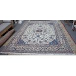 A part silk Nain carpet Persian, the ivory field with an indigo tear drop medallion,