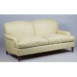 Kingcome Sofas; a modern green upholstered double hump back sofa on turned supports,