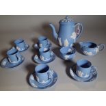 A Wedgwood blue jasper coffee set, 20th century, sprigged in white with classical figures,