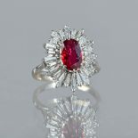 A white gold, ruby and diamond set shaped oval cluster ring,