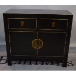 A modern black lacquer side cabinet with two drawers over cupboard, 90cm wide x 80cm high.