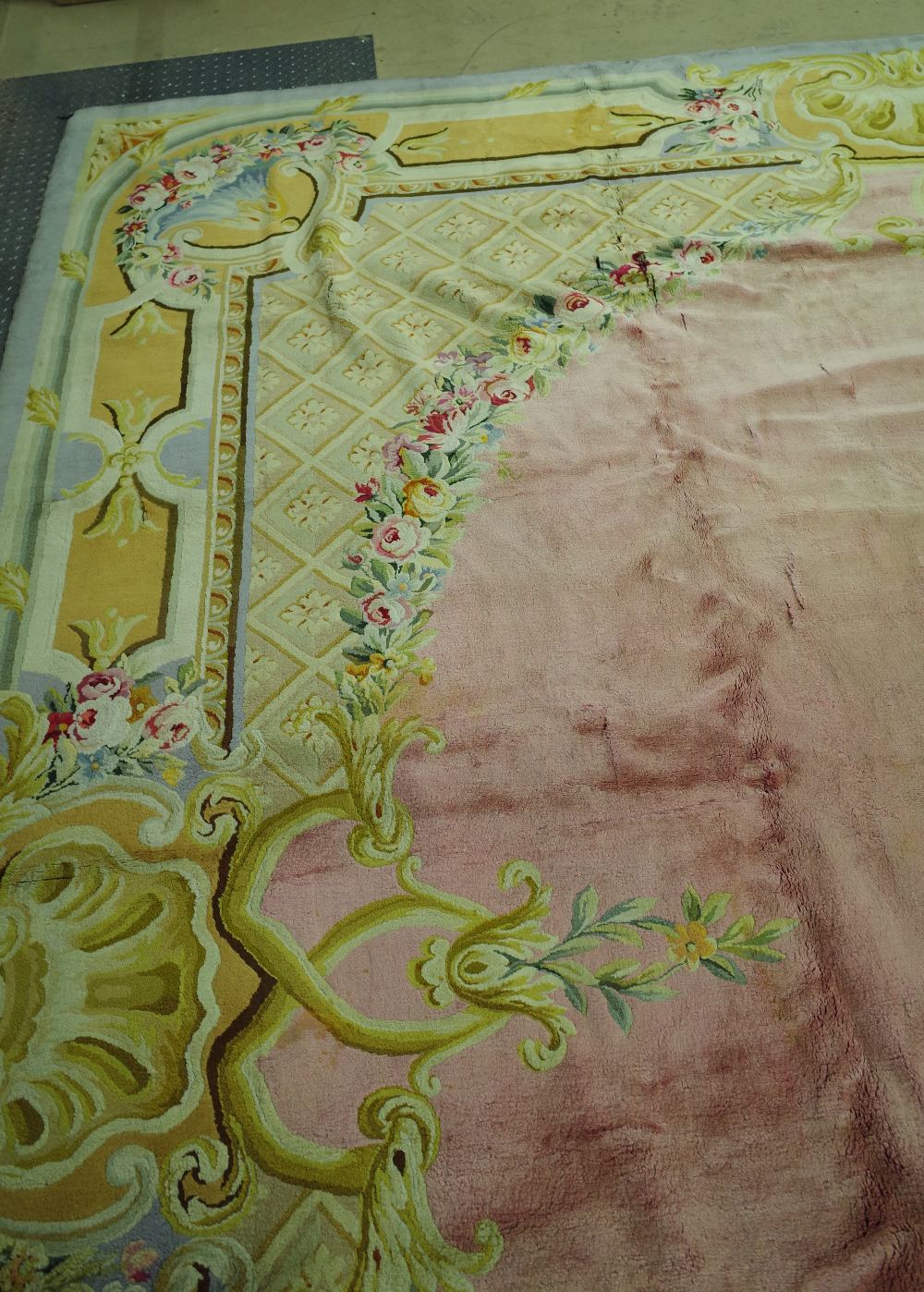 A Savonnerie carpet, French, the plain pale pink field with trellis spandrels and floral garlands, - Image 4 of 16