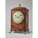 A Regency gilt brass-mounted mahogany and cut brass-inlaid bracket clock The chamfer top with