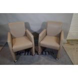 Medalounger; a pair of grey leather upholstered square back armchairs, 60cm wide x 84cm high, (2).