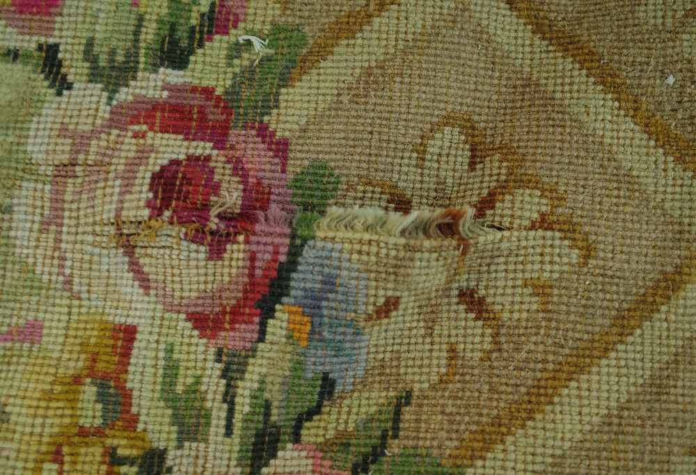 A Savonnerie carpet, French, the plain pale pink field with trellis spandrels and floral garlands, - Image 14 of 16