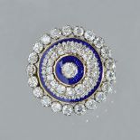 A gold backed and silver set diamond and blue enamelled brooch, of circular form,
