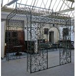 A large modern green painted cast metal rectangular gazebo,