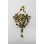 A gold, peridot, seed pearl and gem set pendant, in a lattice pierced wreath and bow design,