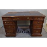 A late 19th century oak pedestal desk, with nine drawers about the knee, 130cm wide x 73cm high.