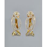 A pair of yellow precious metal and diamond set earclips, of flowerhead and s-scroll design,