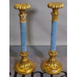 A pair of parcel gilt and blue velvet Rococo Revival candlesticks,