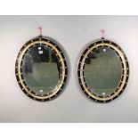 A pair of 19th century Irish oval mirrors,