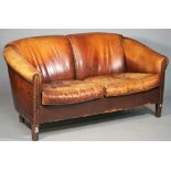 A modern brown leather upholstered tub back sofa on tapering block supports, 150cm wide x 77cm high.