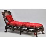A Charles II and later carved walnut day bed,