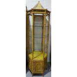A pair of 20th century octagonal bamboo free standing display units of pagoda form,