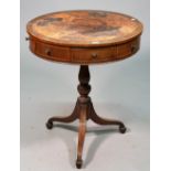 A George III boxwood swing mahogany rent/drum table with four true and four false drawers on