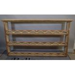 A 20th century cream painted three tier plate rack, 189cm wide x 108cm high.