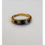 A late Victorian 18ct gold, sapphire and diamond set five stone ring,