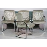 A set of four 20th century grey leather upholstered open armchairs on polished chrome supports,