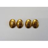 A pair of gold cufflinks, with oval backs and fronts engraved with bull's head crests, detailed 15,