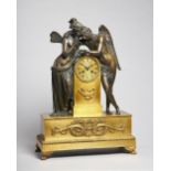 An Empire ormolu and bronze mantel clock of Cupid and Psyche The two figures leaning towards each