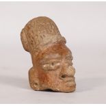 A pre-Columbian Guatemalan terracotta figurehead, probably Kaminaljuyu, C.500 B.