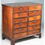 A George III oak chest with two rows of six short drawers on bracket feet, 95cm wide x 93cm high.