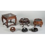 A group of six Chinese hardwood stands, 2.5cm to 14cm high, (6).