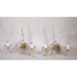 Two sets of four cut moulded and brown glass twin branch wall lights,