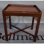A George II style mahogany rectangular side table with galleried top on square supports,