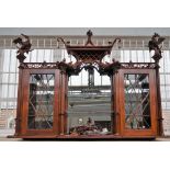 A pair of Chippendale revival mahogany hanging display shelves with pagoda tops and ho ho bird