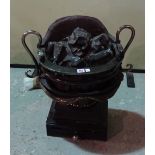A Regency style steel and iron pedestal fire basket.