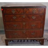 A late George III mahogany chest of two short and three long graduated drawers on bracket feet,