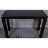 A 20th century black lacquer console table with gloss and matte striped pattern, 127cm wide.