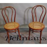 Thonet; a set of four 20th century bentwood dining chairs with cane seats, (4).