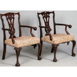 A pair of George II style mahogany open armchairs with pierced splat back and ball and claw arm