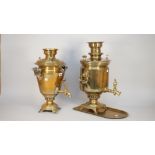 A Russian brass samovar with twin handles and tap, 51cm high and another similar brass samovar, (2).