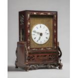 A Chinese hardwood and mother-of-pearl inlaid table clock 19th century The case with a glazed