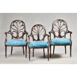 A set of twelve Adam Revival mahogany open armchairs,