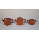 A group of three Chinese Yixing teapots and covers, probably 19th century,