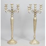 A pair of modern white five branch candelabra, of large proportions,