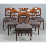 A set of six George III mahogany dining chairs with 'X' frame splat and bow seat on turned supports,