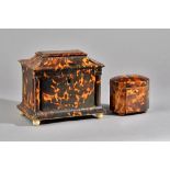 A Regency tortoiseshell tea caddy, the swept rectangular top enclosing a twin lidded interior,