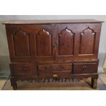 A 17th century oak mule chest, later adapted, 140cm wide x 112cm high.