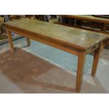 A late 19th century rectangular pine kitchen table with single drawer on tapering square supports,