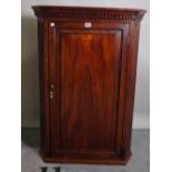 A George III mahogany hanging corner cupboard, 68cm wide x 97cm high.