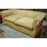 A 20th century hardwood framed sofa with roll over arms and mustard upholstery, 230cm wide.
