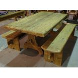 A 20th century pine kitchen table on lyre supports united by a stretcher,