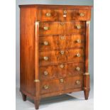 A 19th century French gilt-metal mounted marble topped mahogany tall chest of six drawers flanked