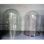 Two circular glass domes 32 and 31cm high; 23 and 21.5cm diam.